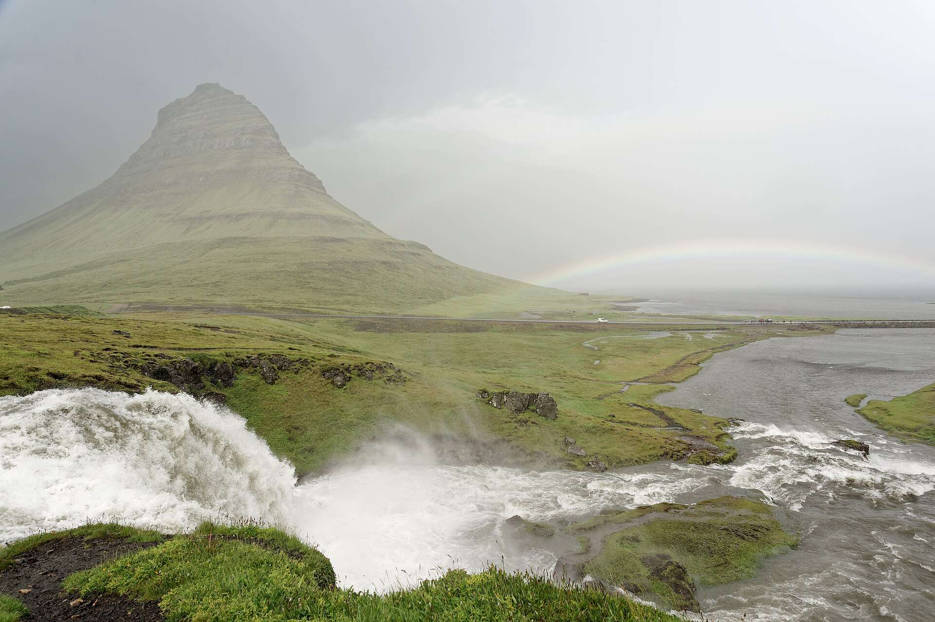 Kirkjufell and Kirkjufellsfoss under a rainbow